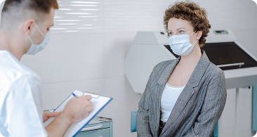 Healthcare provider reviewing notes with a patient
