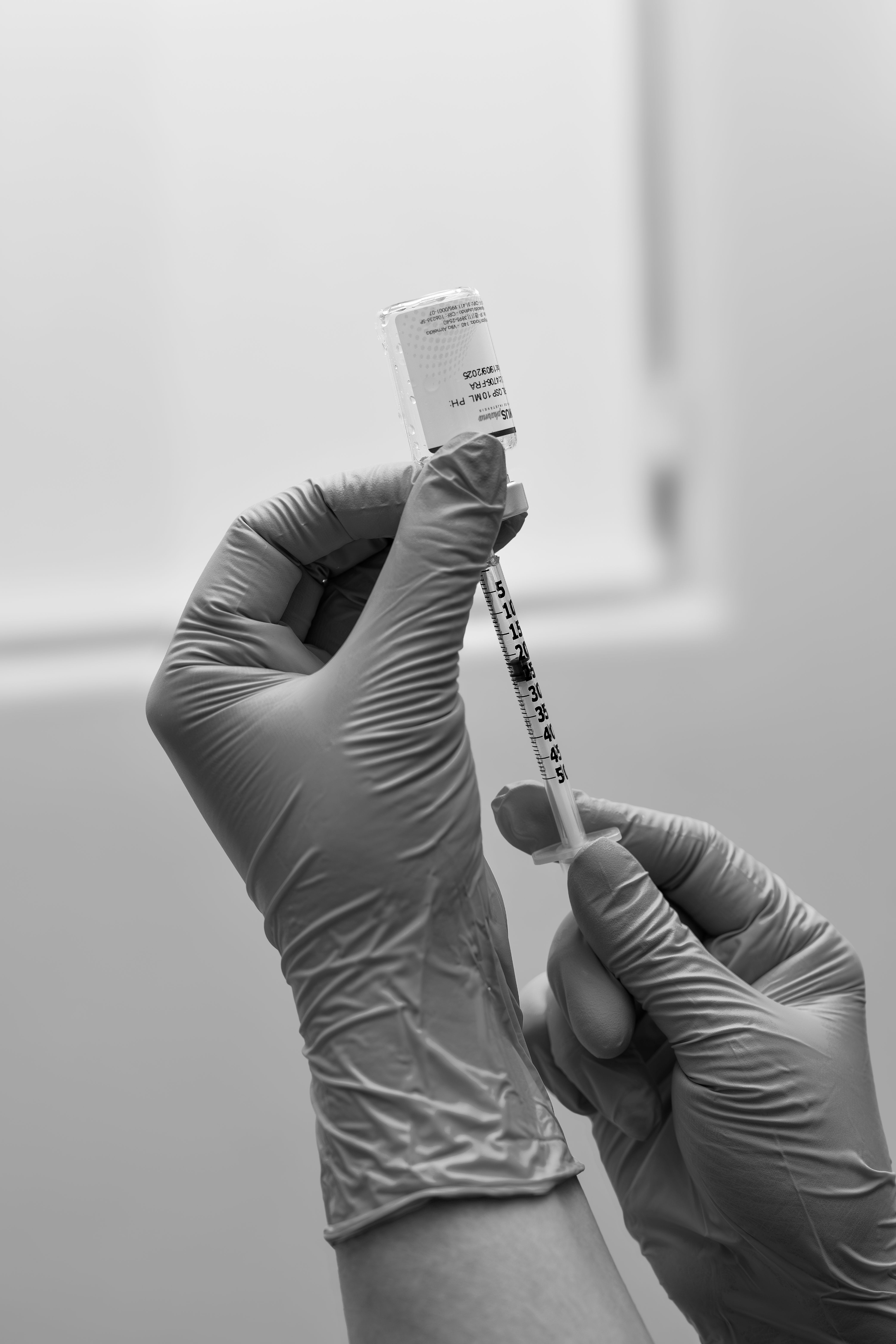 Medical professional preparing a prescribed injection