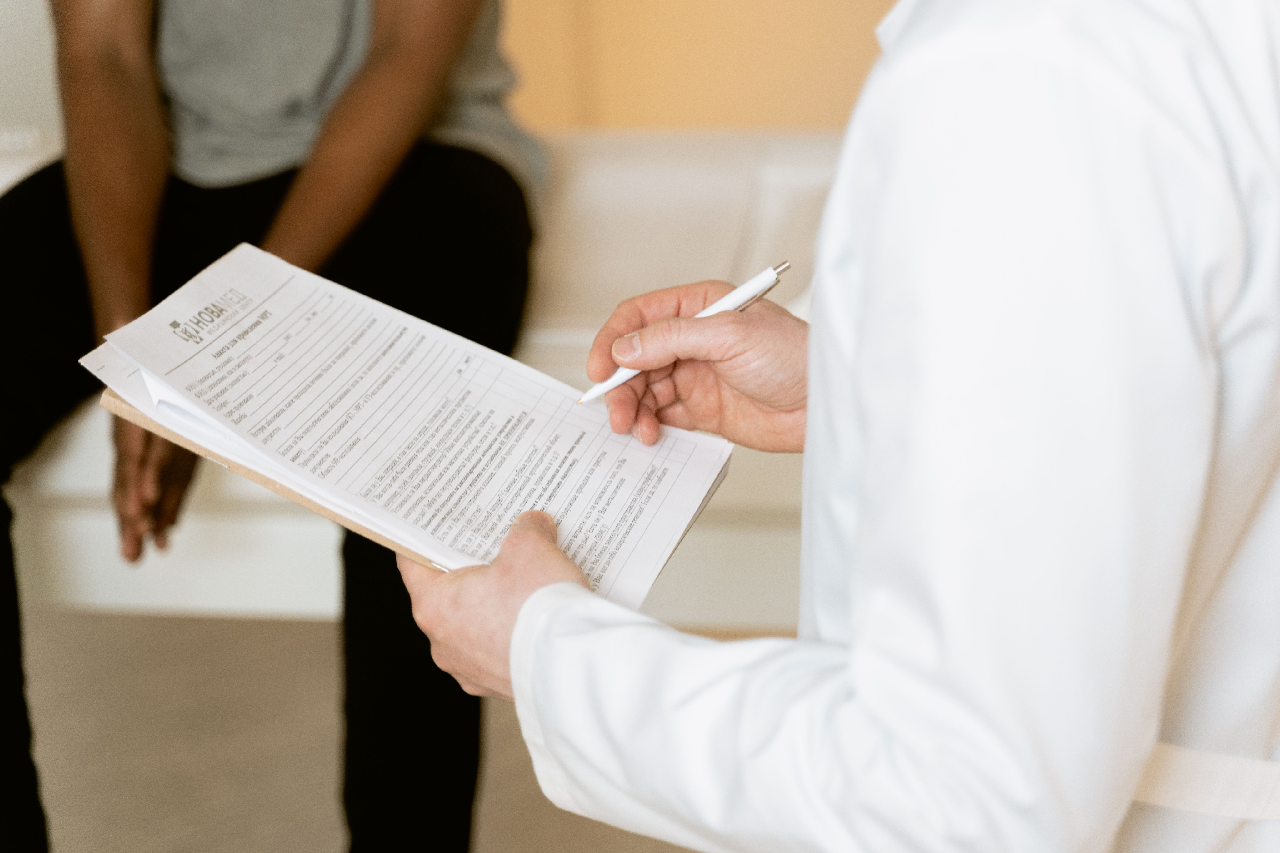 Healthcare provider supporting a patient during treatment