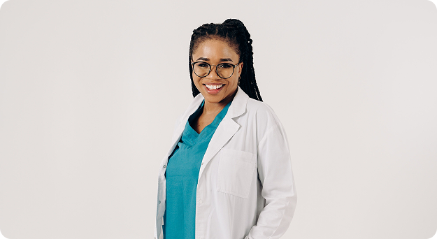 Dr. Sarah Mitchell in a white coat over teal scrubs