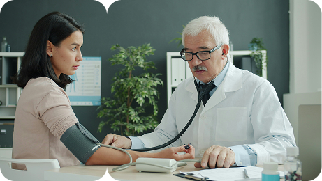 Doctor measuring a patient's blood pressure during a consultation